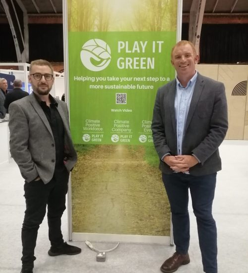 Co-founders Chris and Richard stand in front of Play it Green sign at Progress21